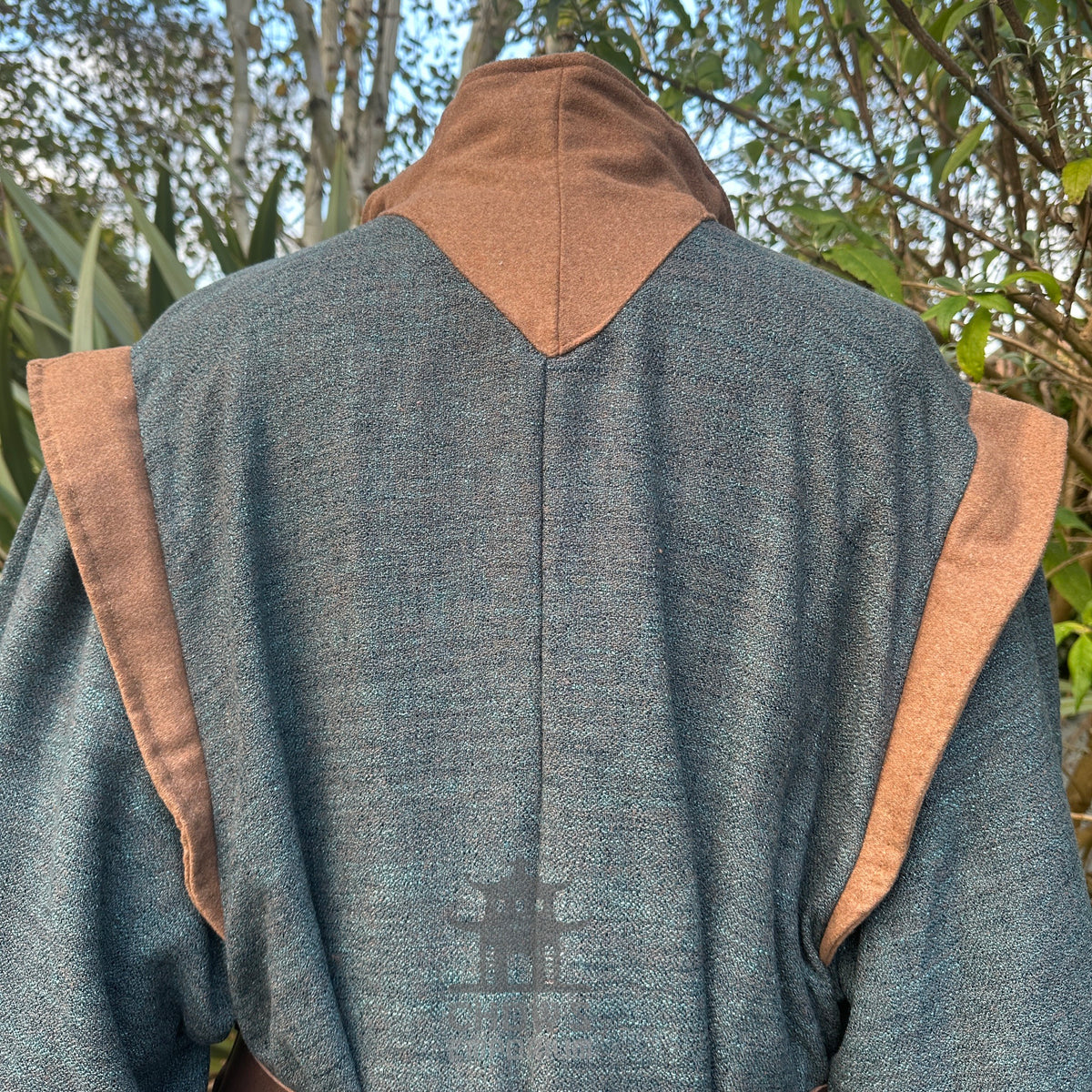 Back Close-up of high collar and neckline on teal and brown LARP robe, medieval fantasy cosplay.