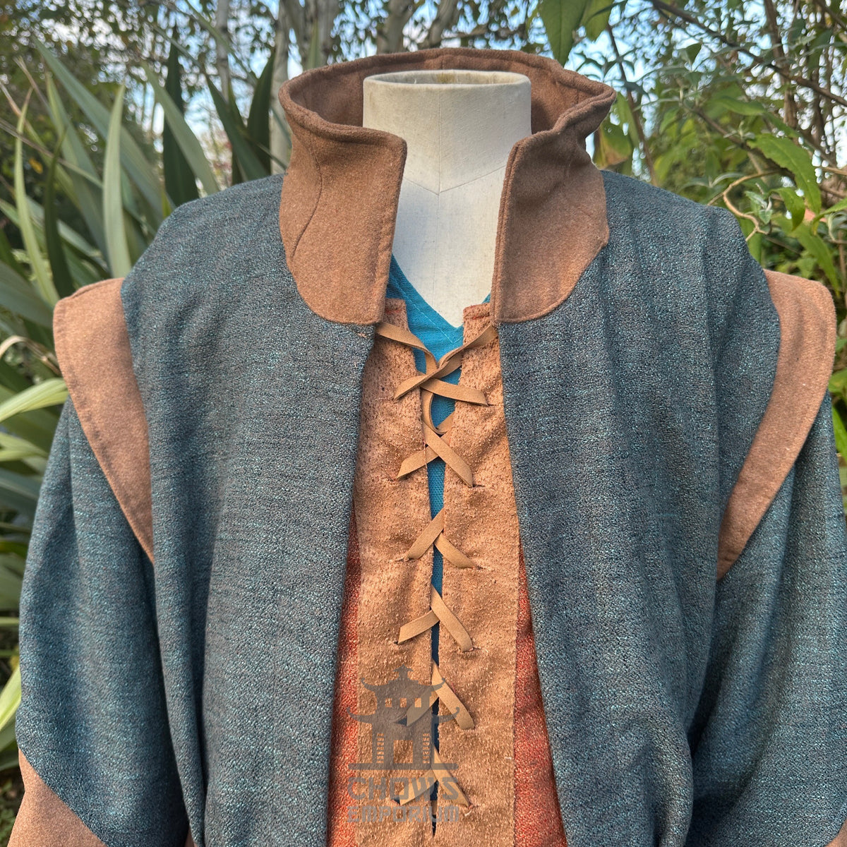 Close-up of high collar and neckline on teal and brown LARP robe, medieval fantasy cosplay.