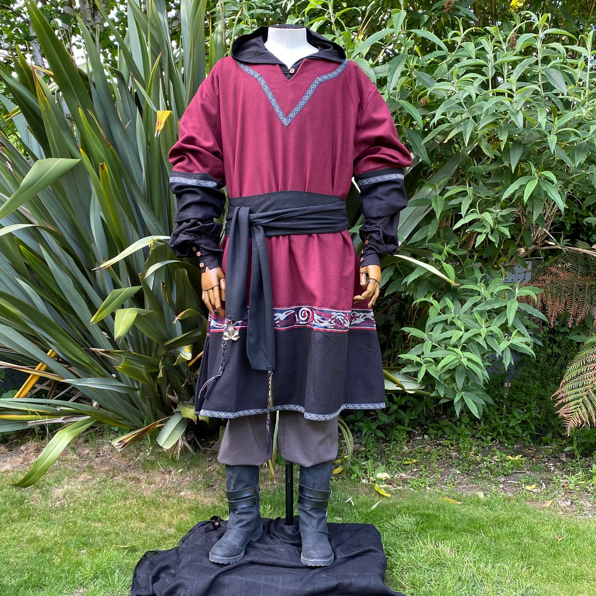 Medieval LARP outfit, red tunic with black sash.