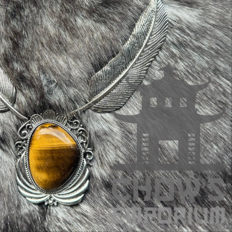 Silver feather necklace with amber stone, ideal for medieval LARP attire.