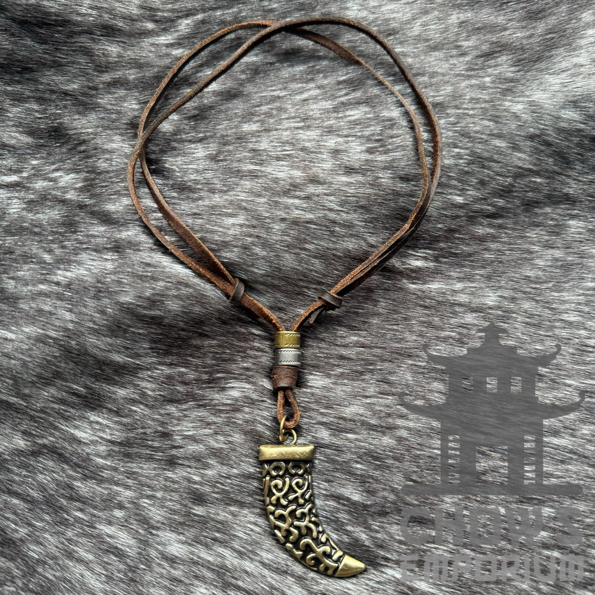 LARP Celtic tooth necklace with ornate bronze design, brown leather cord.