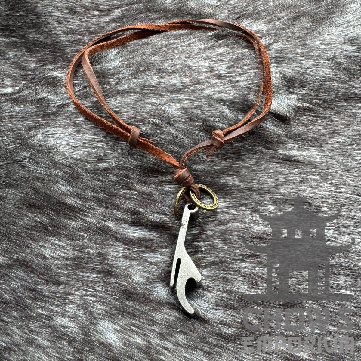 LARP bottle opener necklace with brown leather cord on fur background.