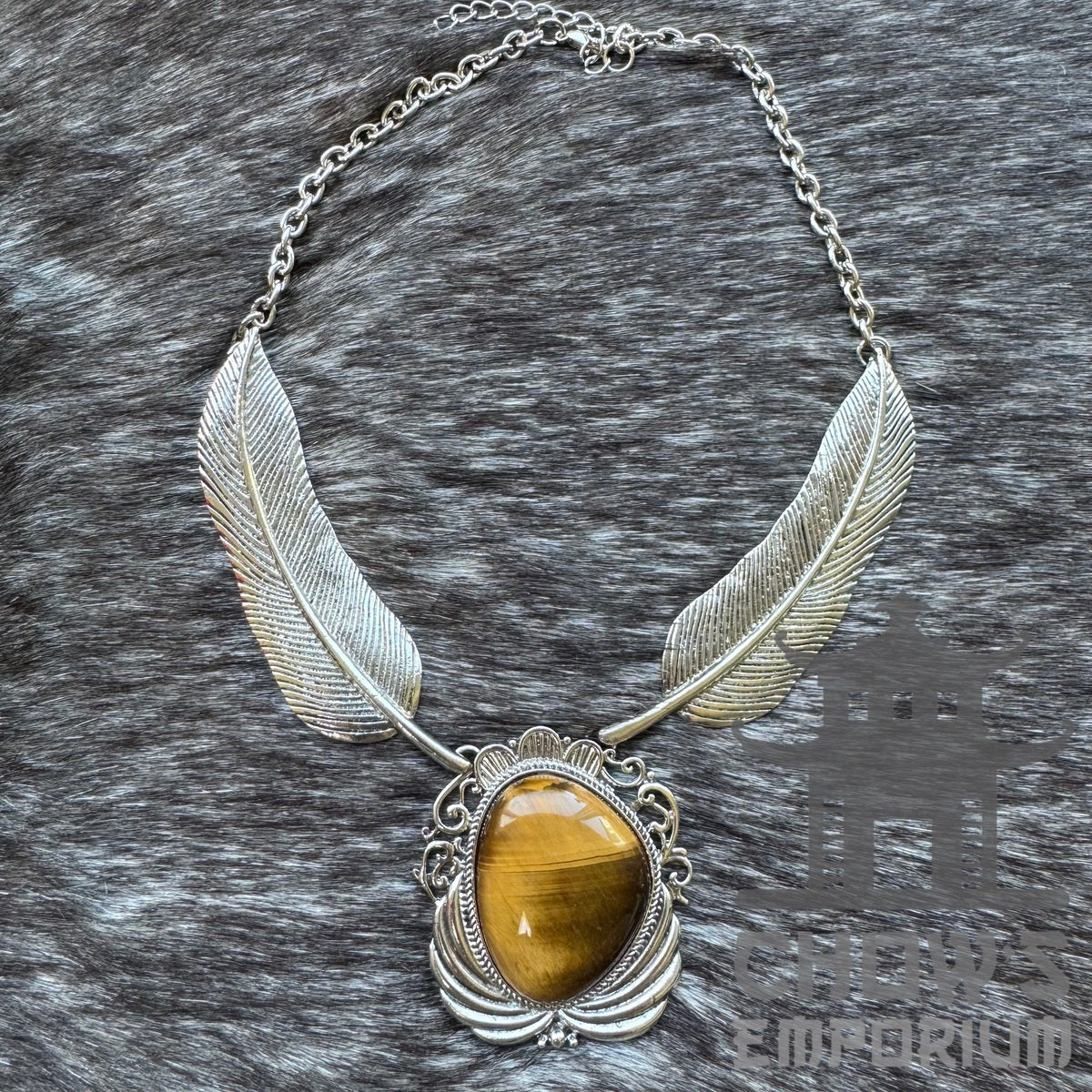 Silver necklace with amber gem, feather accents for LARP.