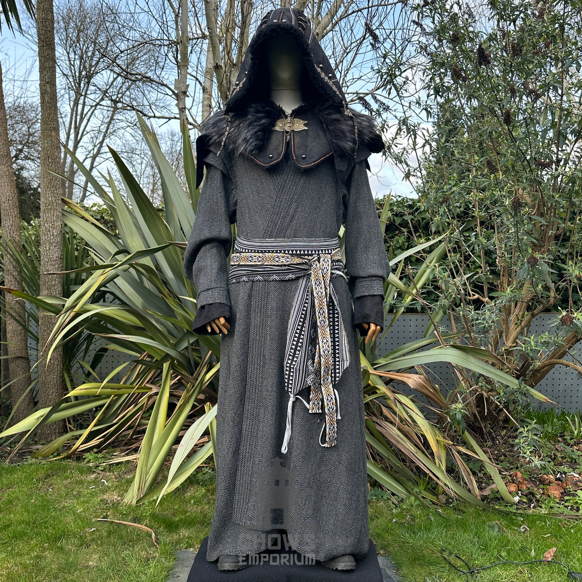 LARP medieval sorcerer outfit in garden; grey robe and black ornate hood front view.