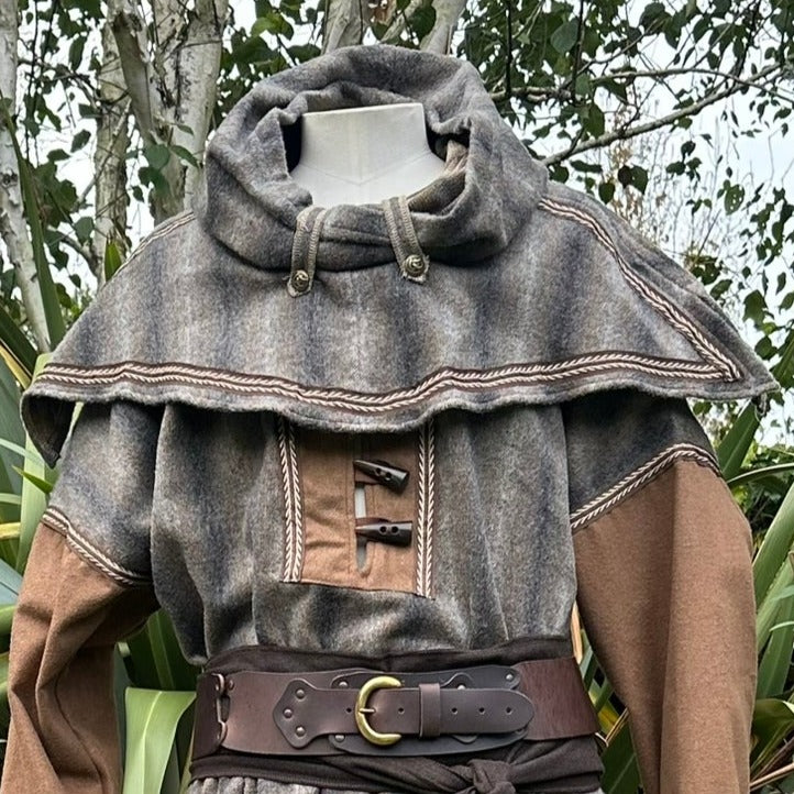 Medieval LARP hood close-up with toggles and earthy tones.