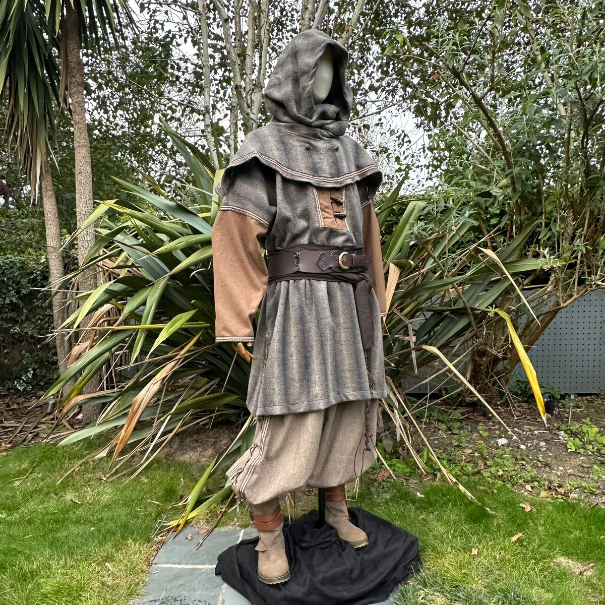 Medieval LARP snood hood drapes over mannequin amid.