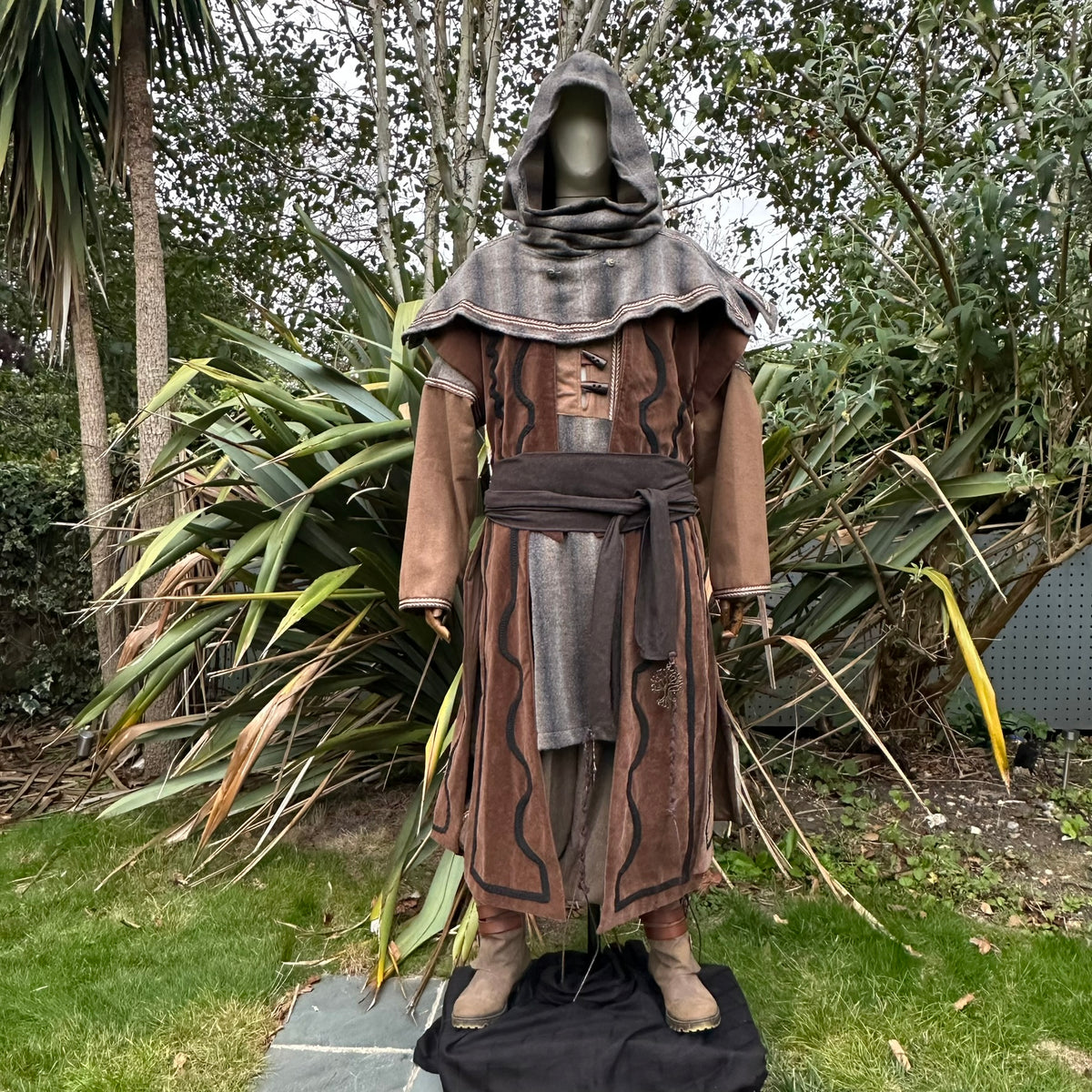 Rustic LARP snood hood draped over a mannequin.