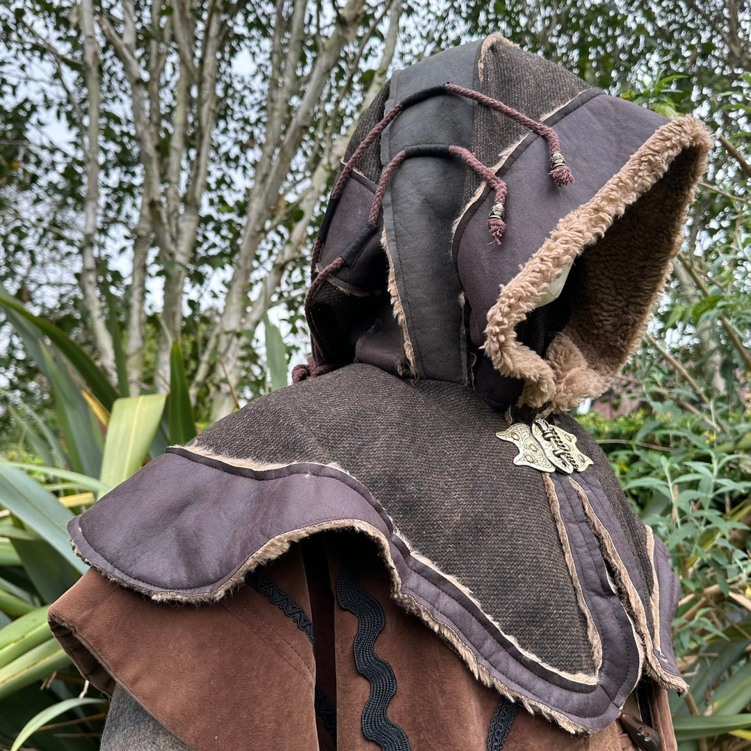 This Layered LARP Hood in Brown & Green Faux Leather has a Fleece Lining in Brown. This Viking Hood is Water Resistant towards rain. The Medieval Hood covers your shoulders and provides warmth. Perfect for your LARP Character and LARP Costume, Cosplay Event, and Ren Faire.