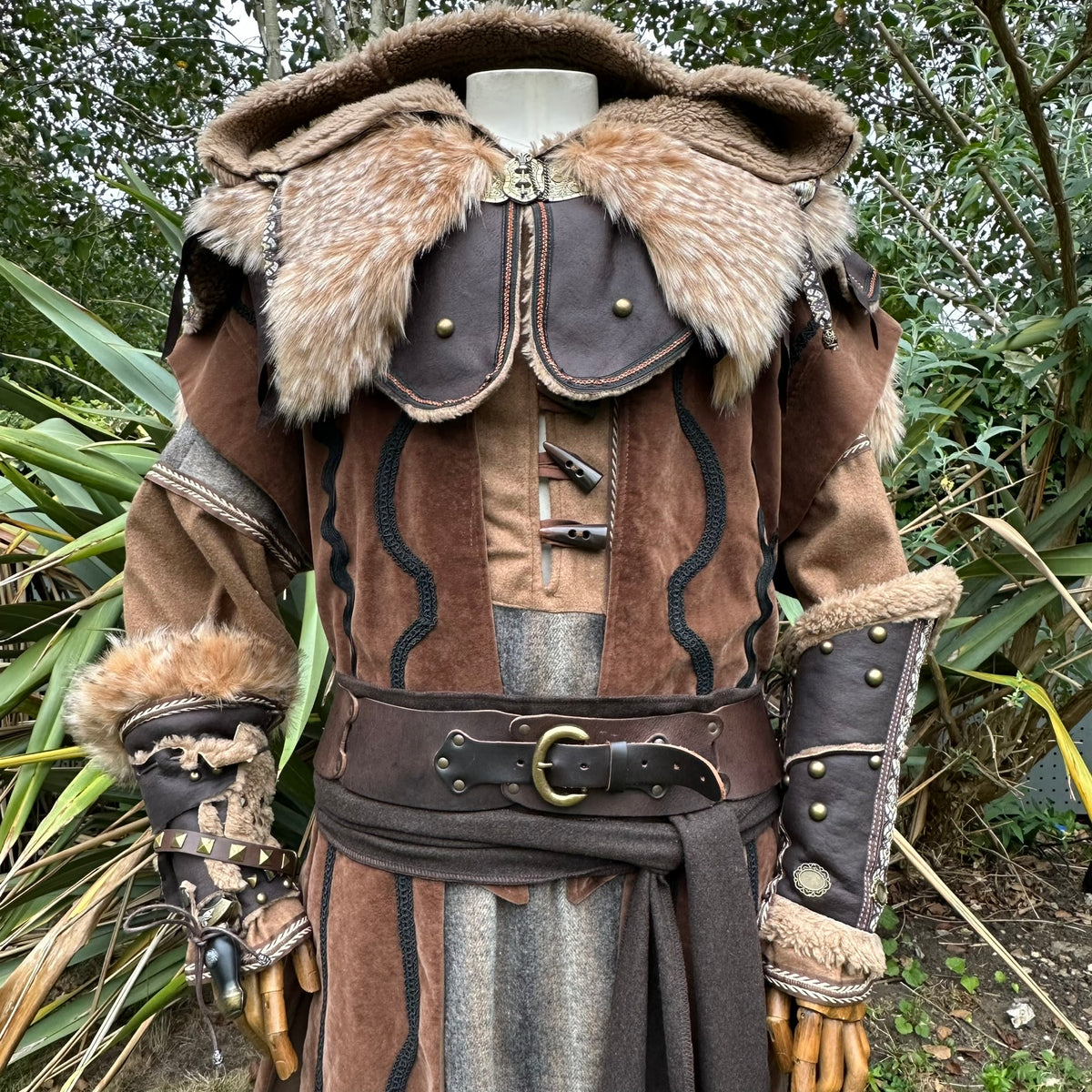 Mannequin in ornate medieval LARP hooded cloak, faux leather with fur trim.