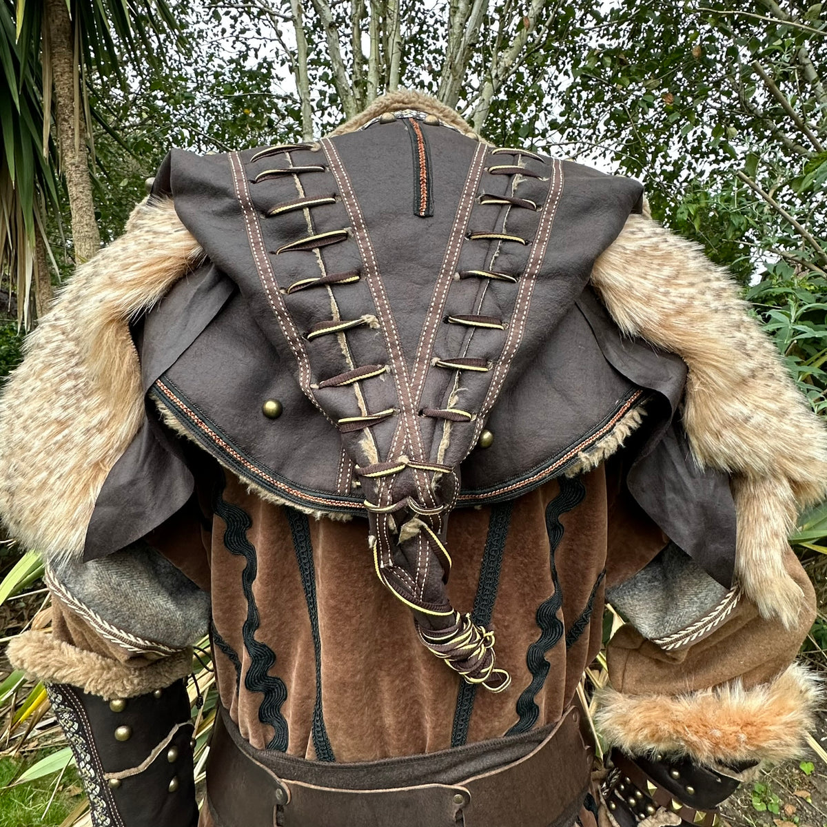Back view of a medieval LARP hood with lace-up details and faux fur trim.