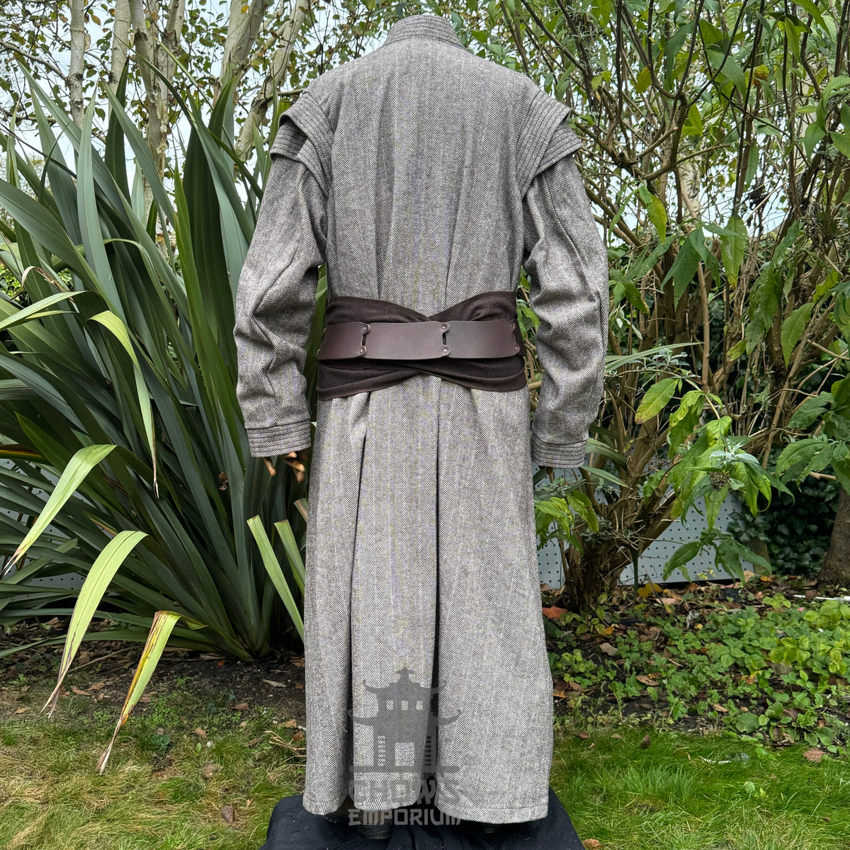 Back view of brown medieval LARP robe with belt worn over the outer layer, authentic fantasy.