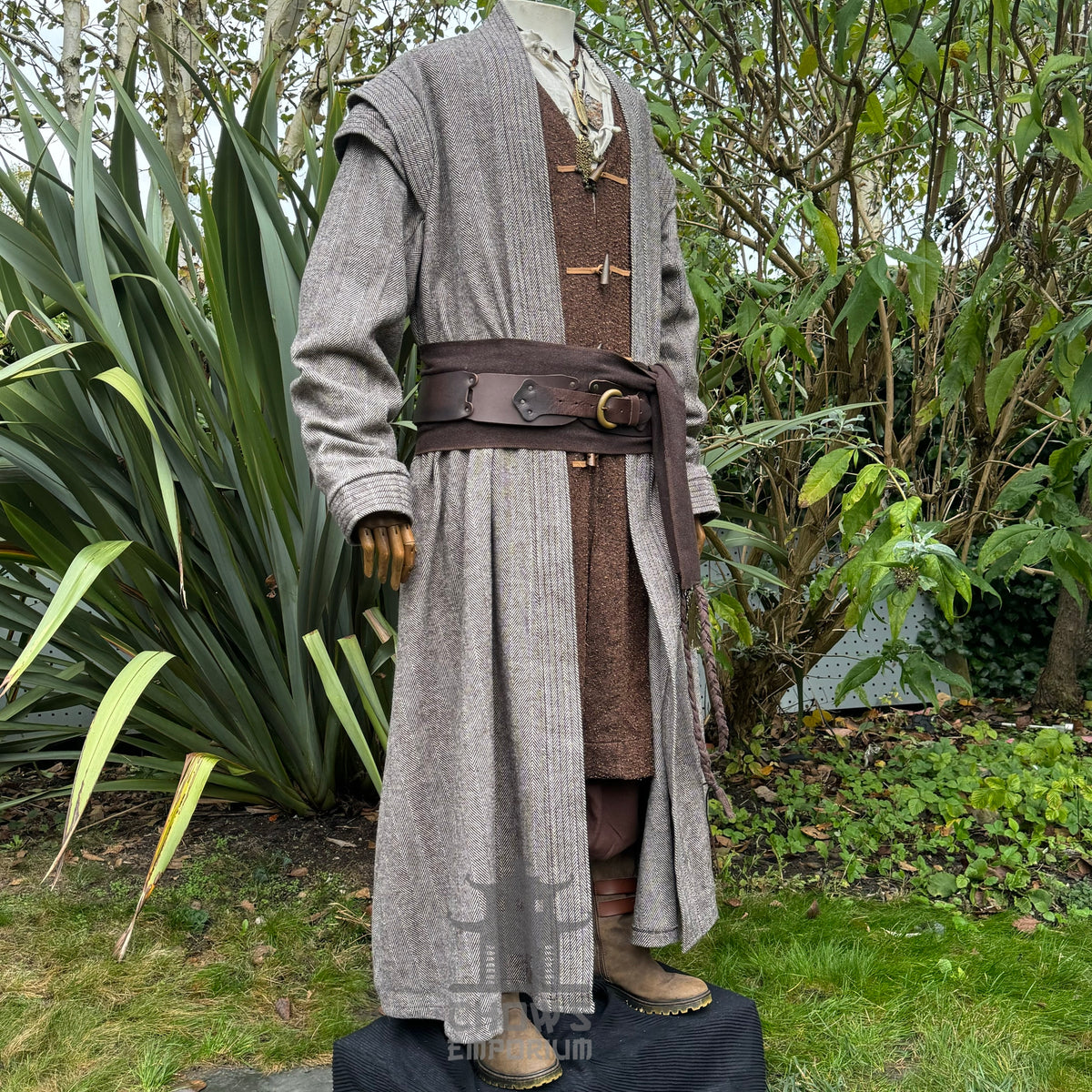 Mannequin wearing brown medieval LARP robe with wide belt.