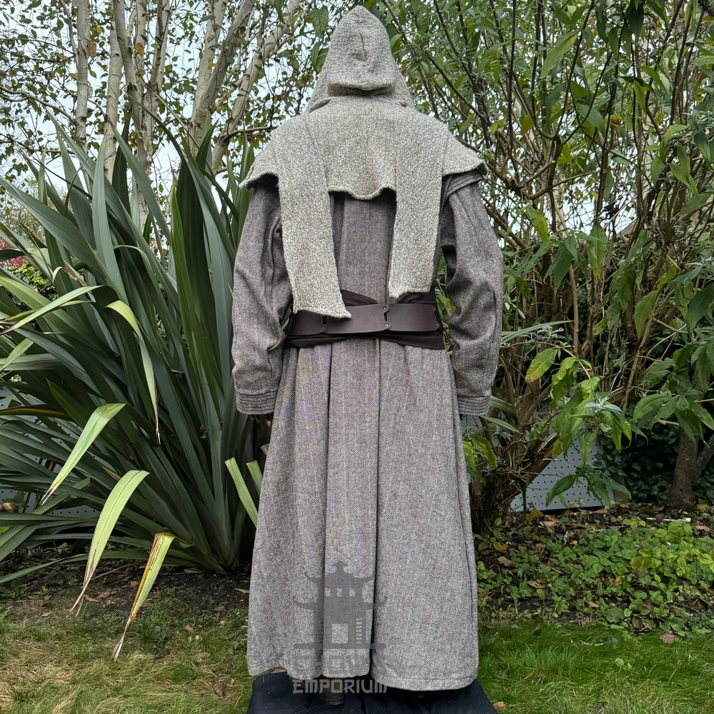 Medieval LARP costume back view, featuring a brown full length robe, two-tone jacket, hood, trousers, belt and sash. For Renaissance Faire and historical roleplay events.