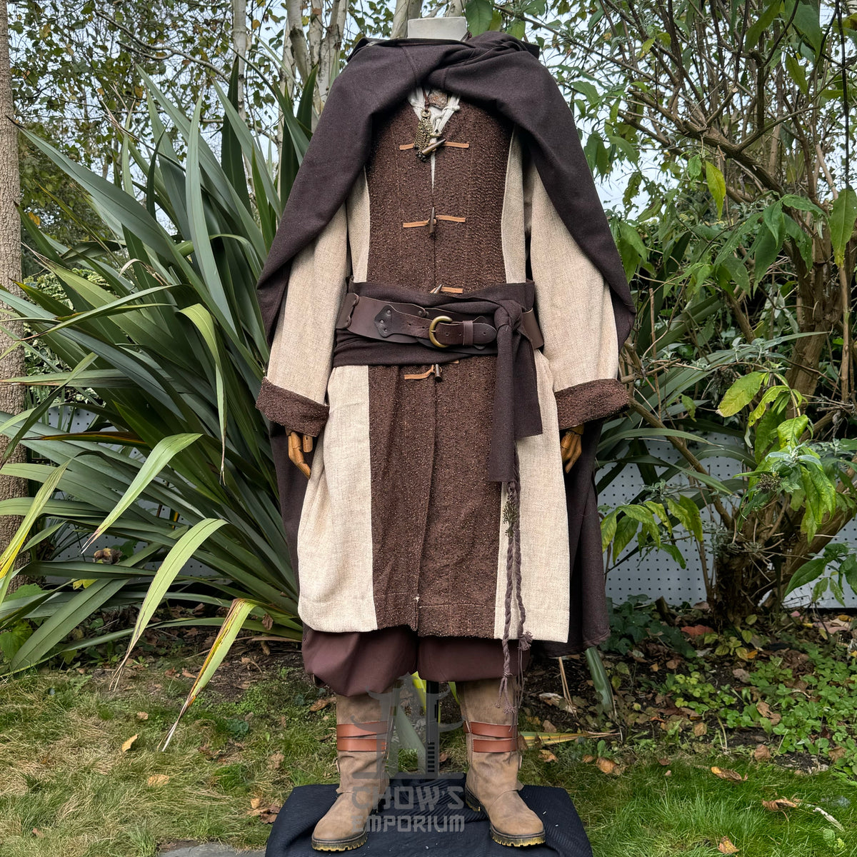 Medieval LARP outfit with dark cloak, layered tunic, and boots.