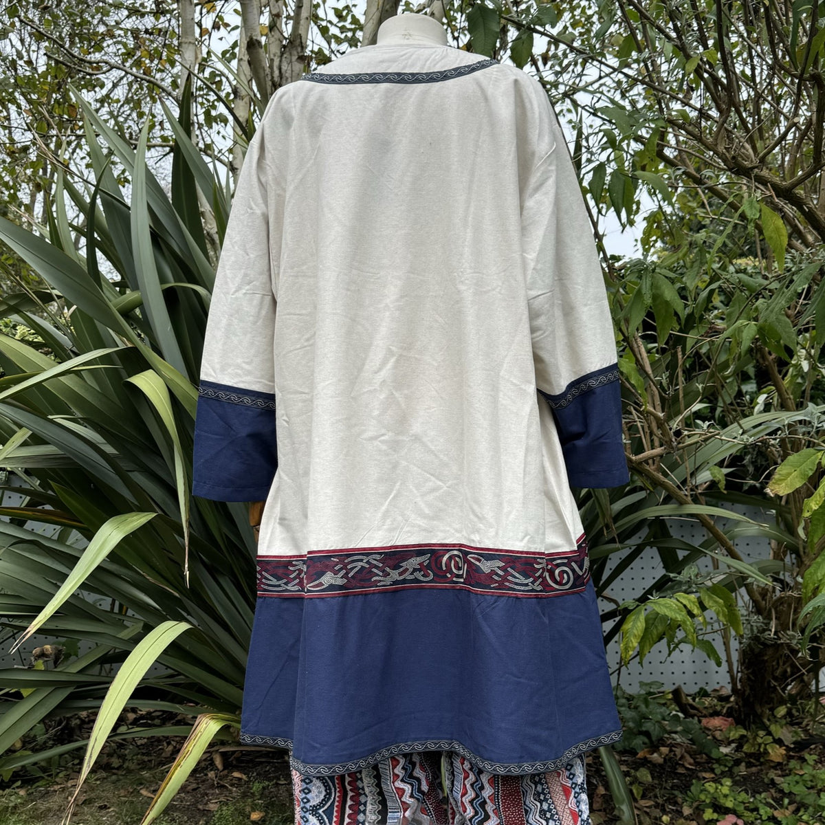 Off-white and navy LARP robe with red trim, displayed on a mannequin.