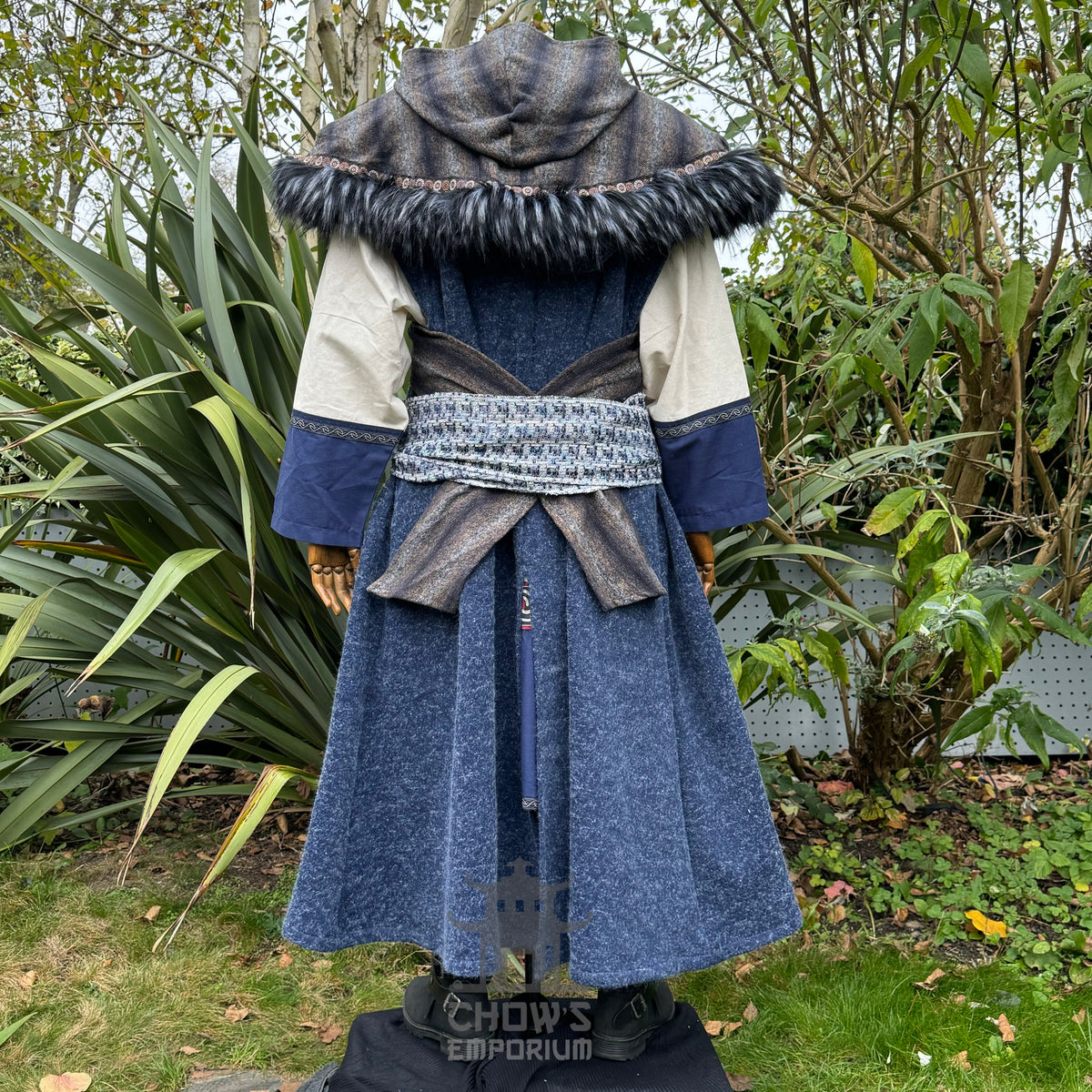 Back view of blue and grey LARP robe set with hood, fur trim, tunic, and sash.