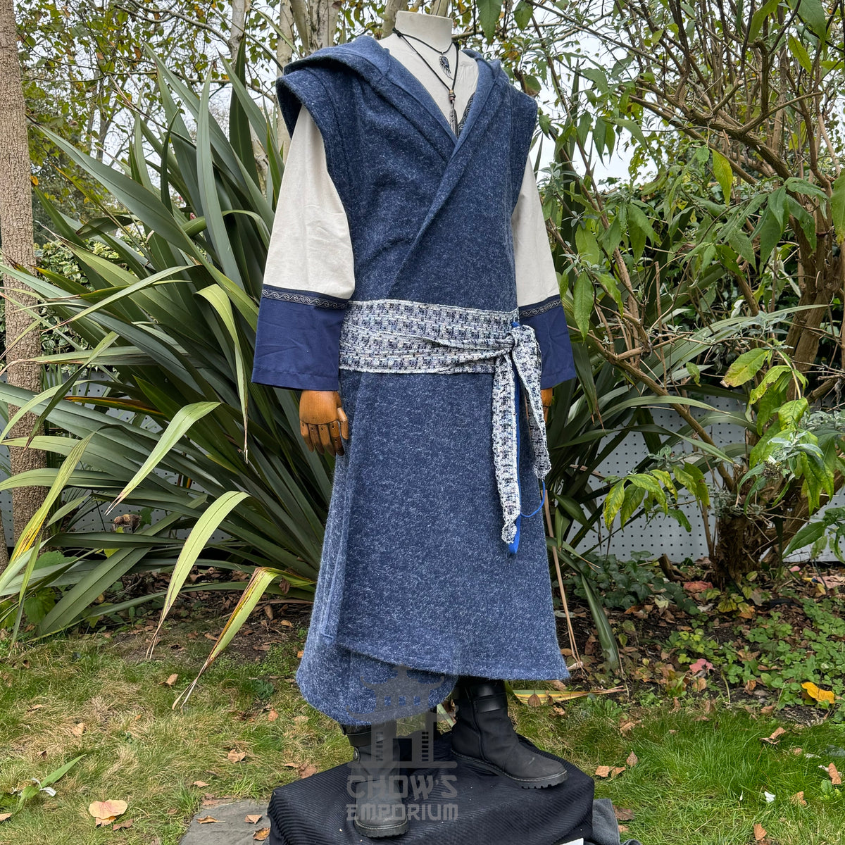 Blue woolen LARP robe, beige tunic, patterned sash, side view.