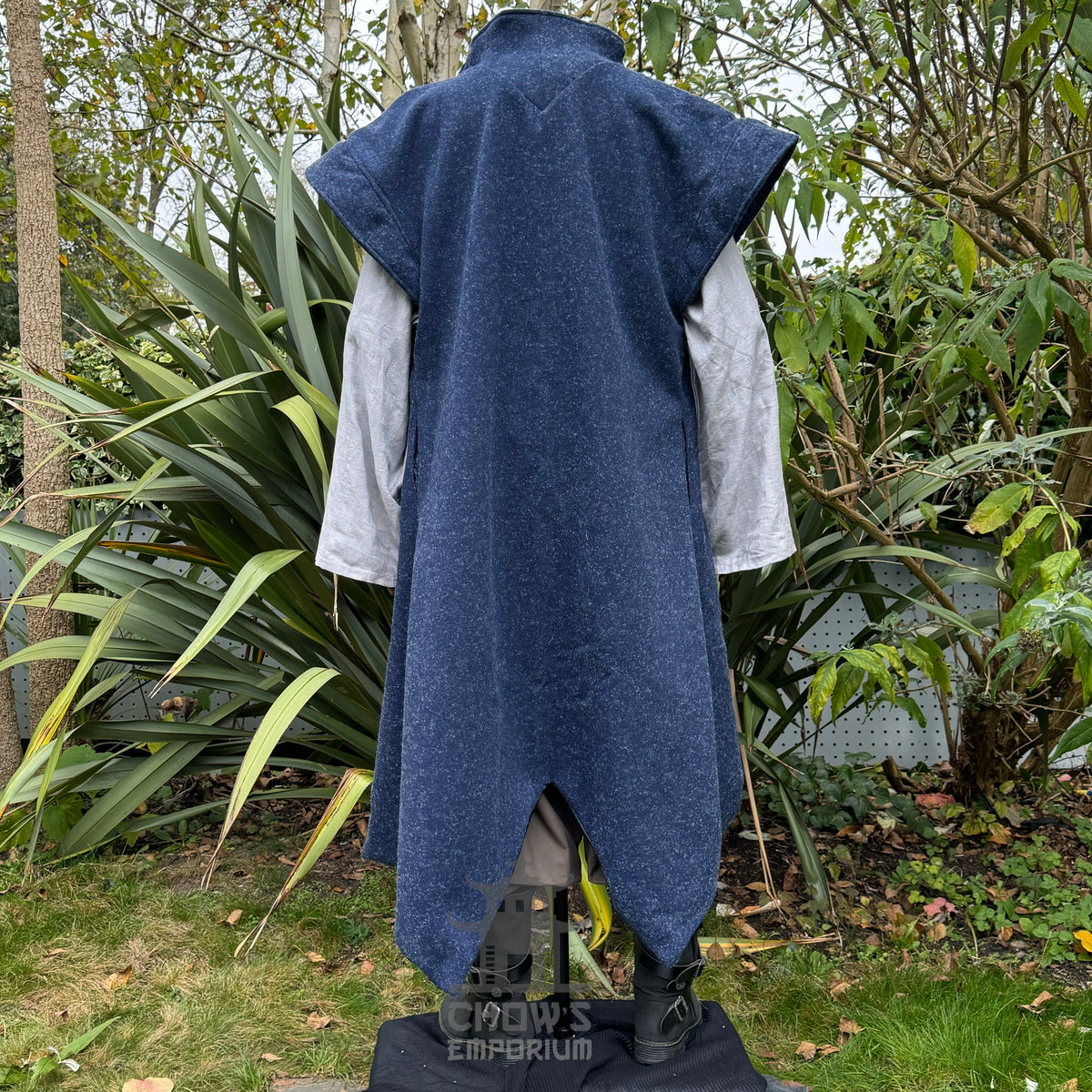Rear angle of LARP elven waistcoat with pointed hem, blue wool fabric.