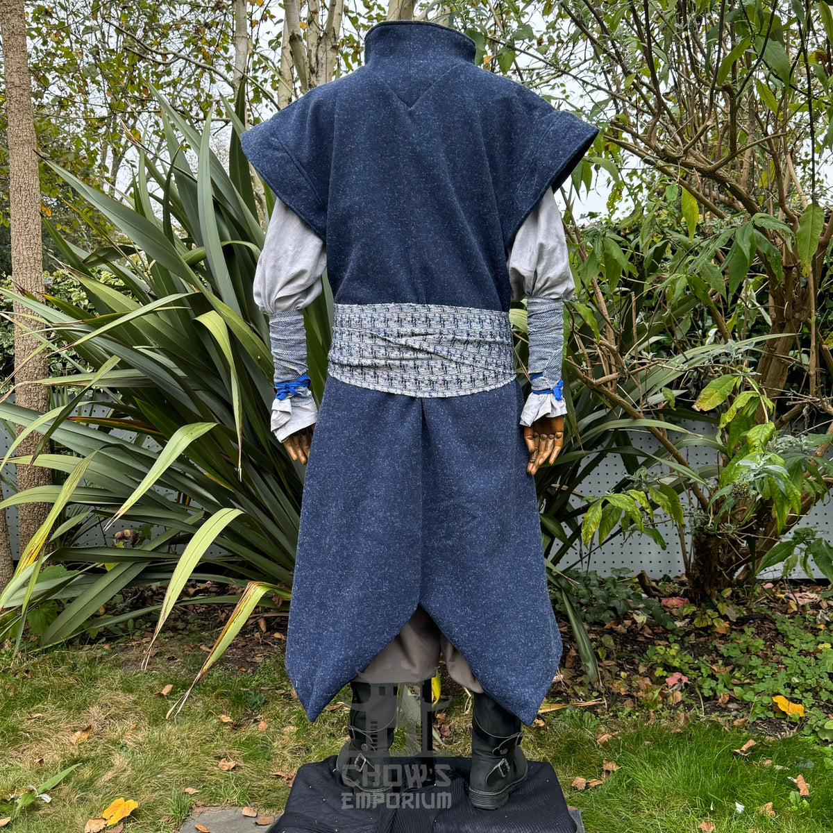 Rear view of blue wool LARP waistcoat with textured belt detail.