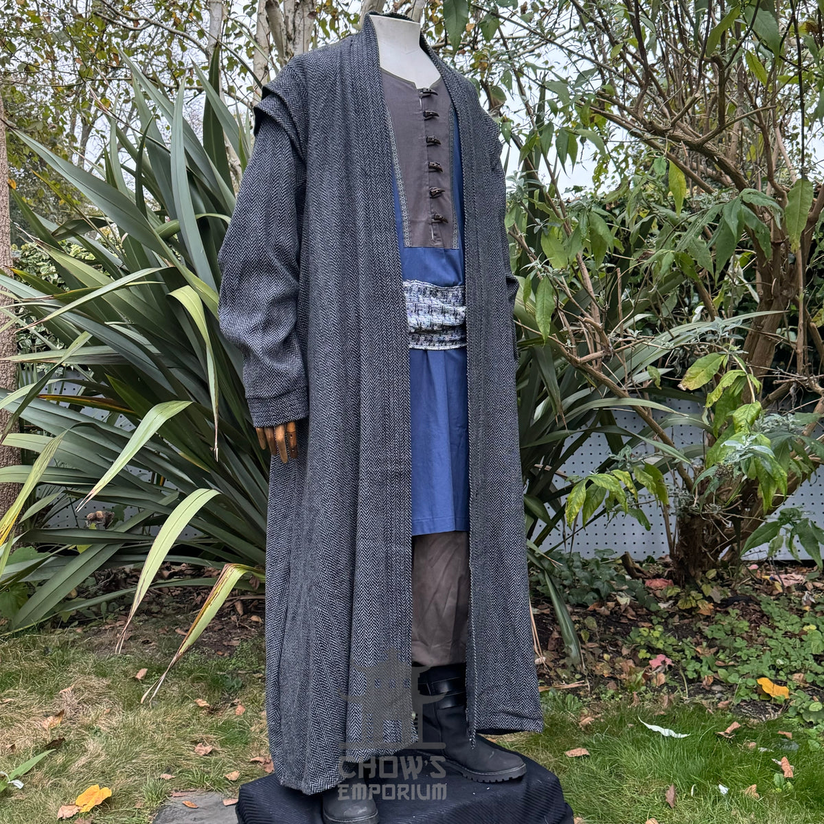 Medieval LARP costume side view, featuring a grey full length robe, blue two-tone tunic.