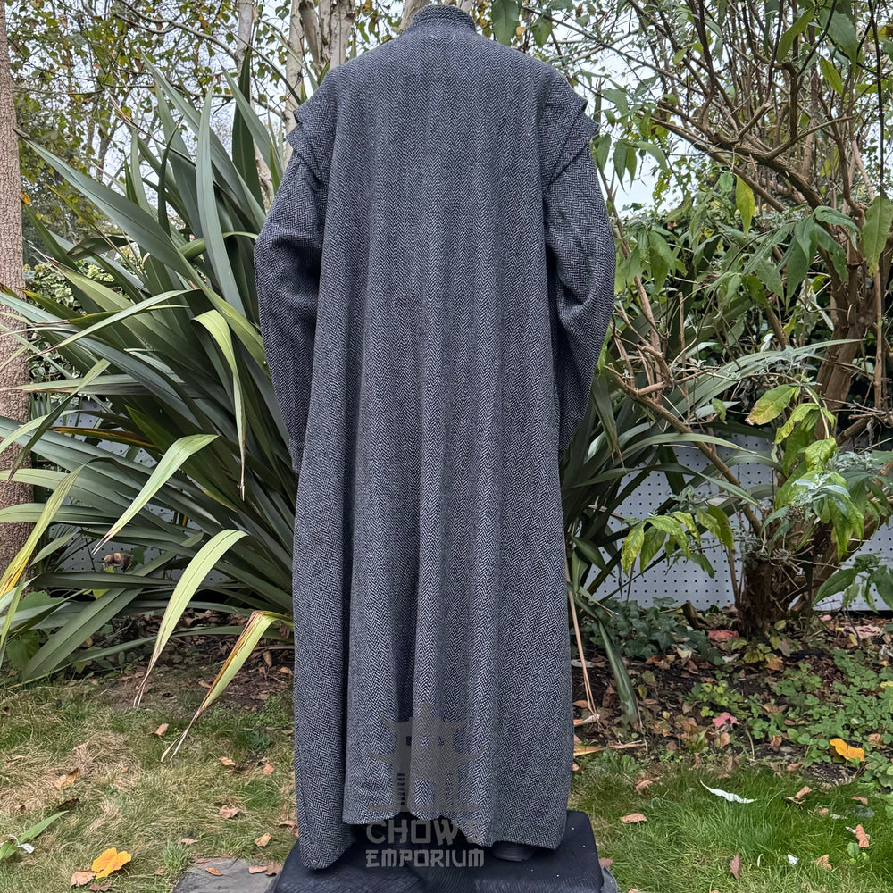 Medieval LARP costume back  view, featuring a grey full length robe, blue two-tone tunic, trousers, belt and sash. For Renaissance Faire and historical roleplay events.