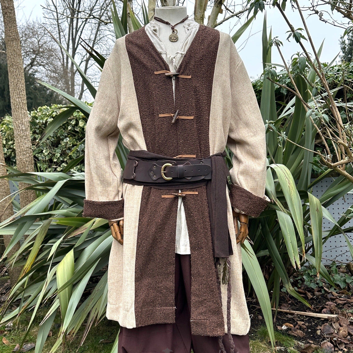 A two-tone medieval-style robe/tunic with a contrasting suede-effect front panel and cuffs.