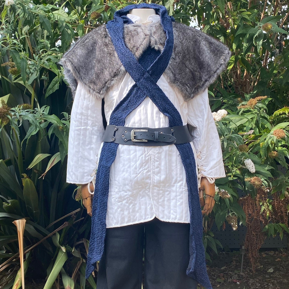 Medieval LARP costume with blue-grey crossed hood and fur mantle front view.
