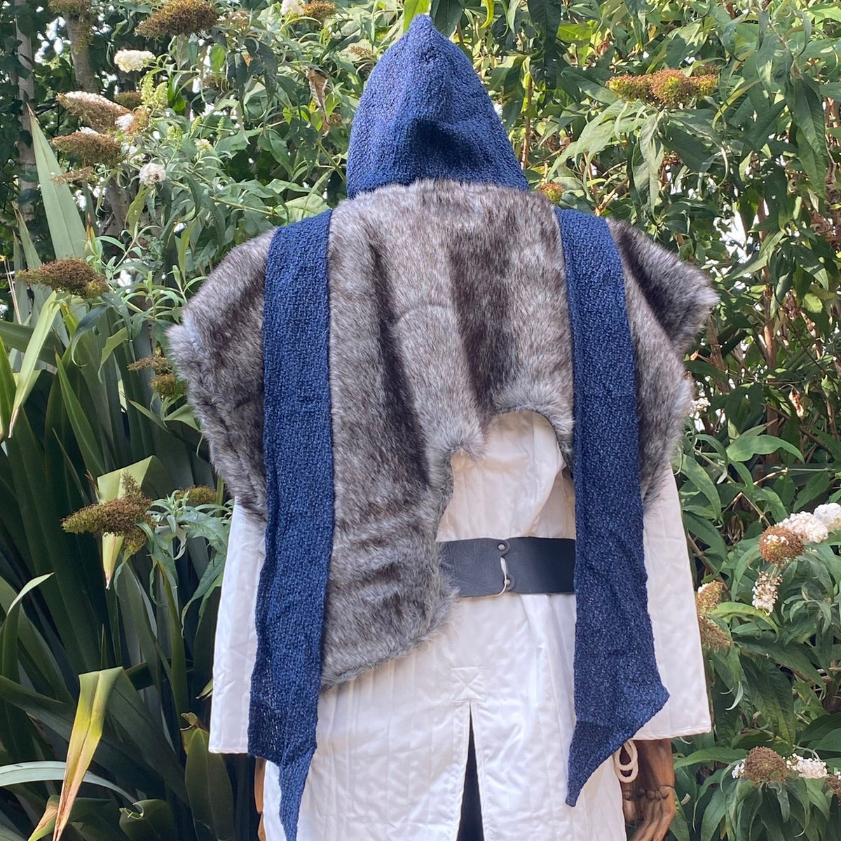 Blue knitted hood and grey fur mantle for LARP, rear view.