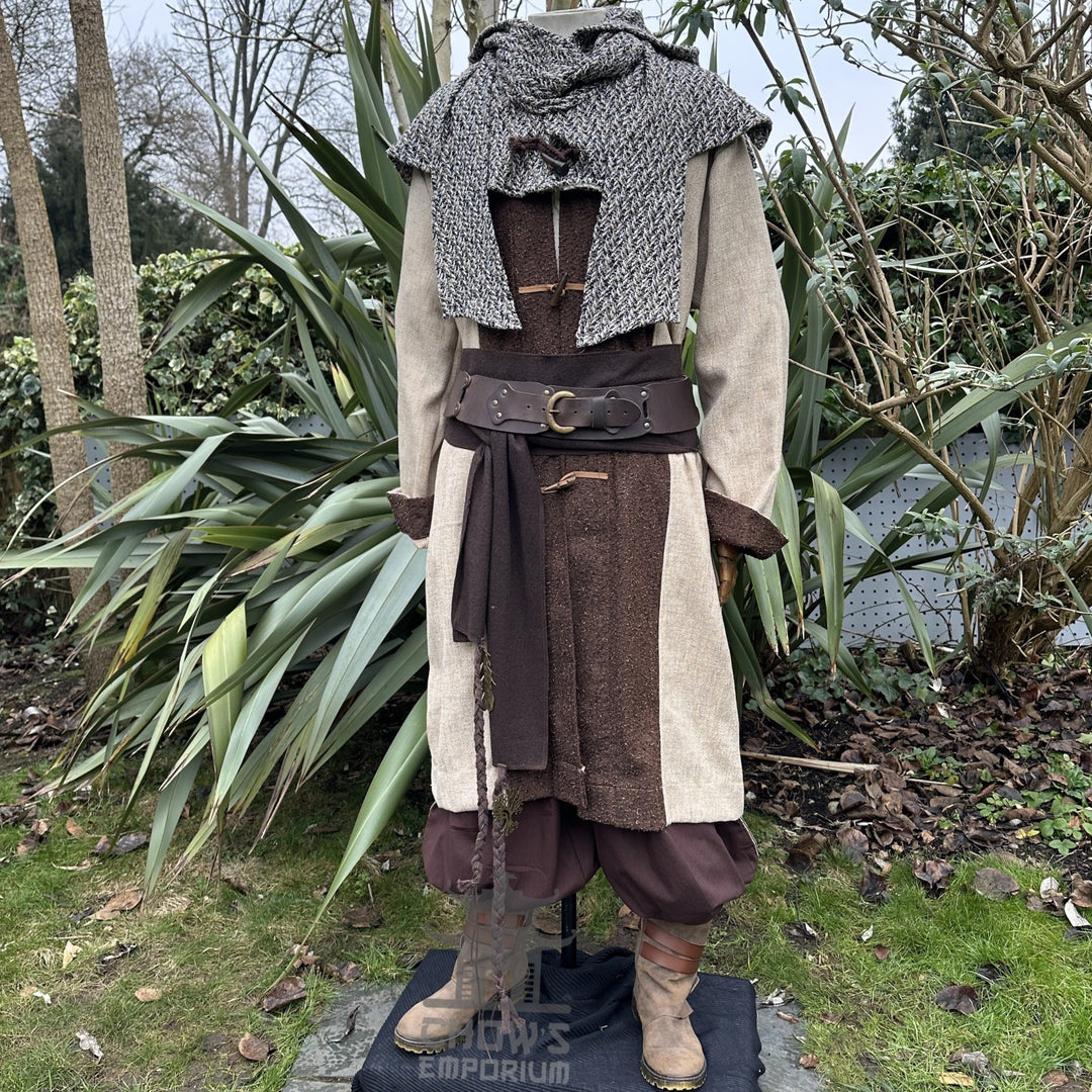 Medieval LARP outfit side view, featuring a two tone jacket, hood and trousers. For Renaissance Faire and historical roleplay events.