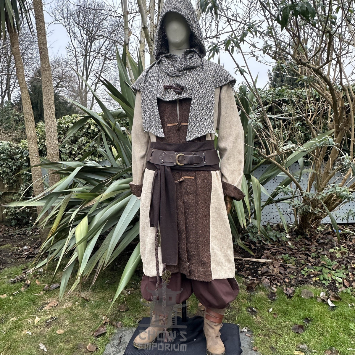 LARP medieval set with brown wool jacket, patterned hood, and brown trousers.