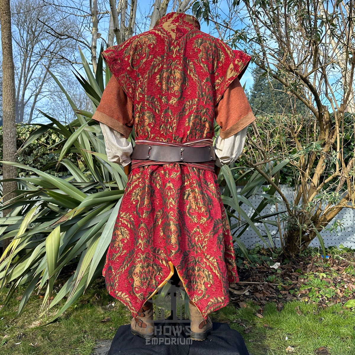 Medieval LARP garment back view with vibrant red tapestry design.