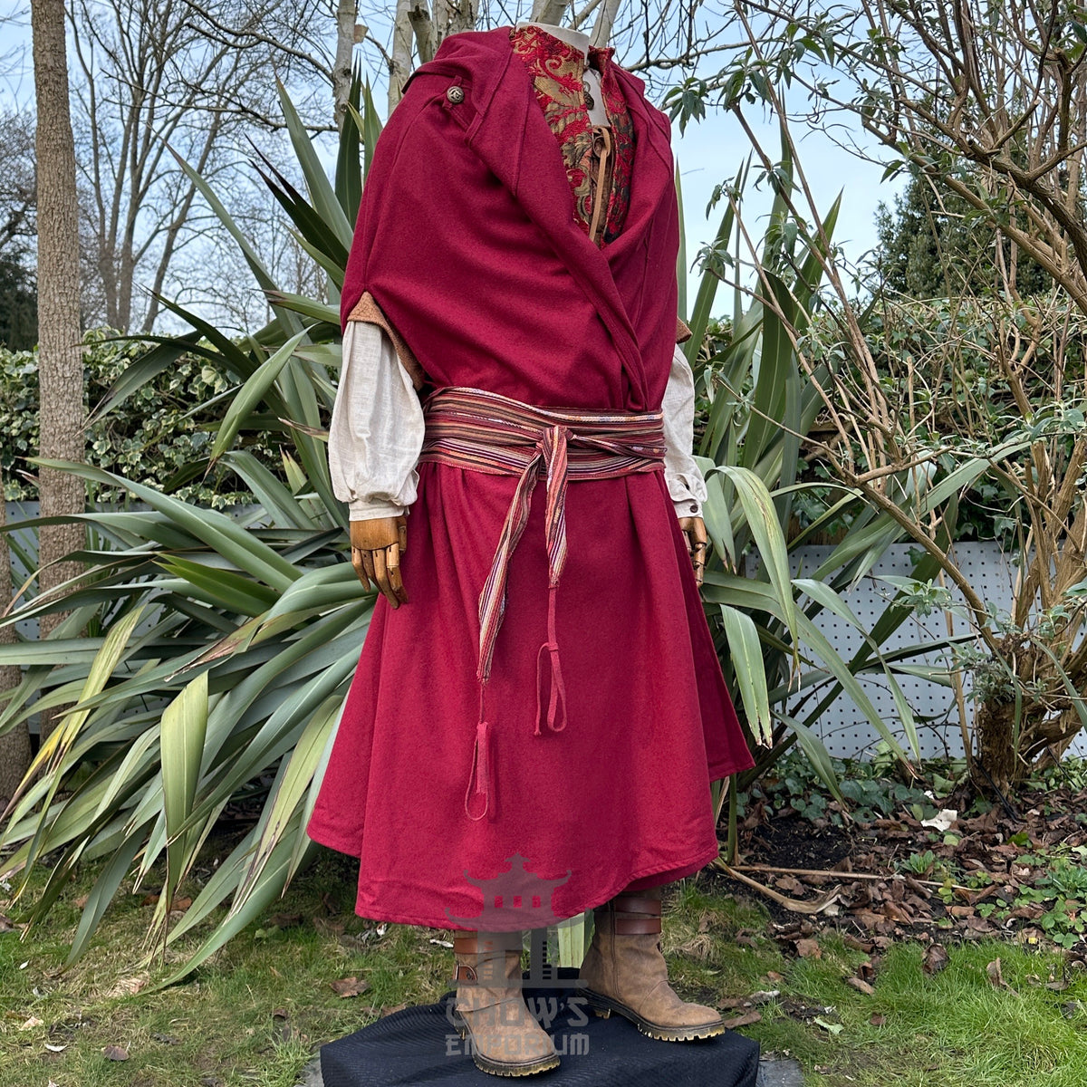 Crimson LARP ensemble with red cloak, tunic, sash, and detailed necklace.