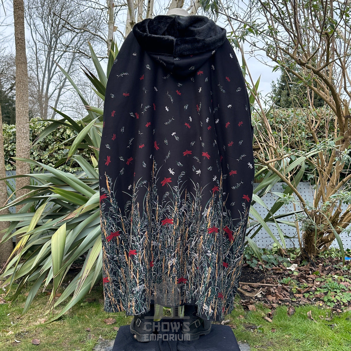 Black cloak with fur lining, intricate nature motifs for LARP.