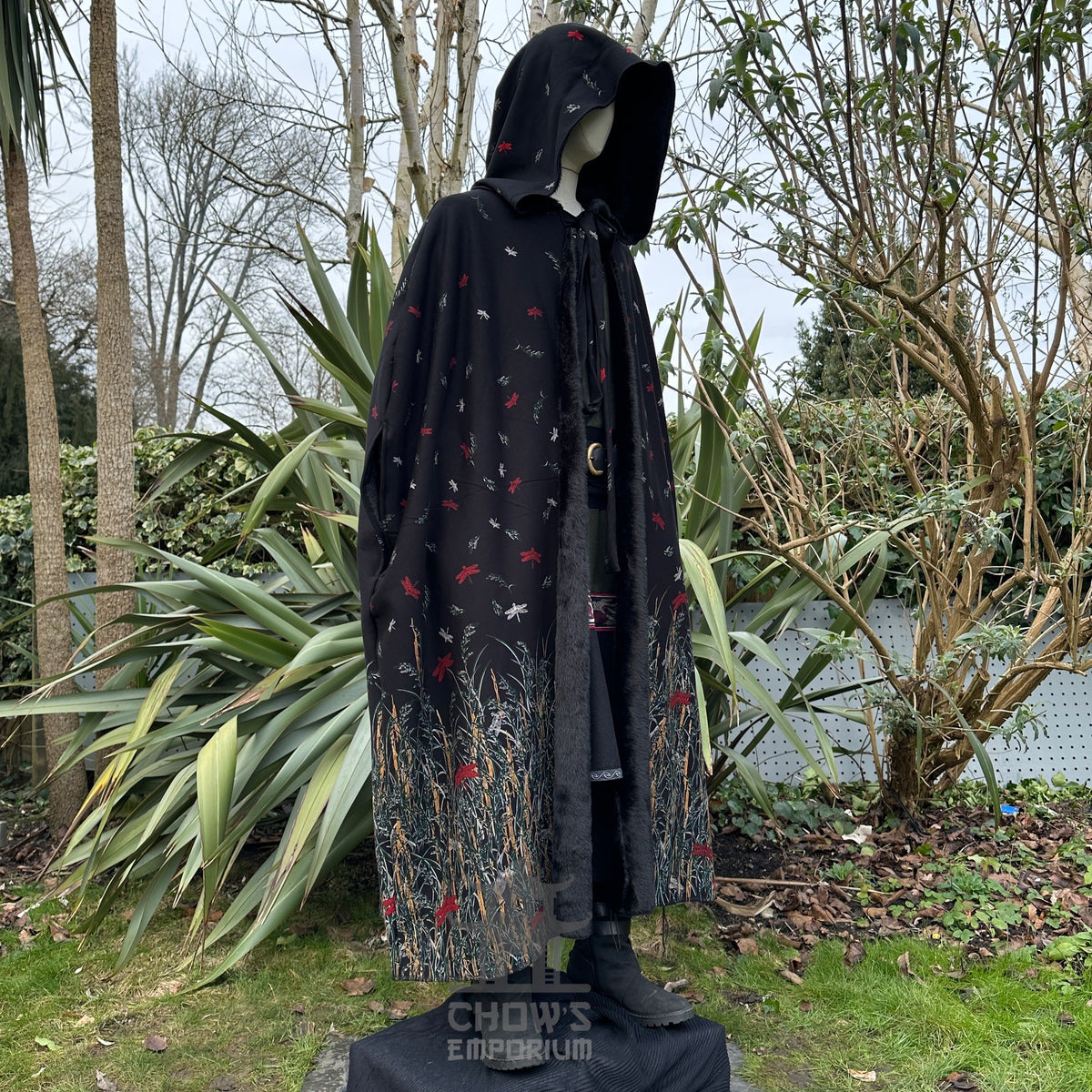 LARP medieval black cloak with hood, nature motifs, fur-lined, side view.