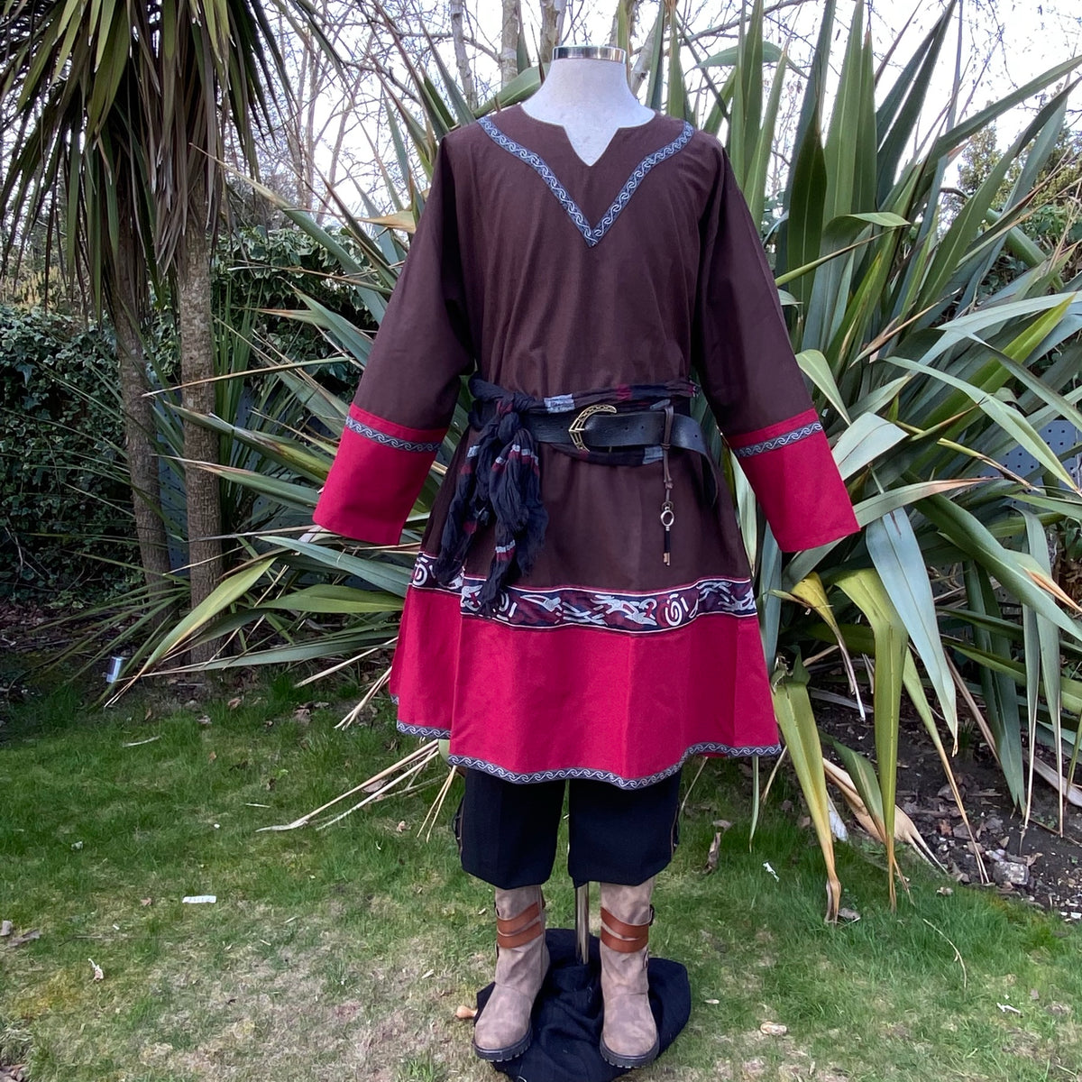 Medieval LARP outfit with intricate trim and leather belt, front.