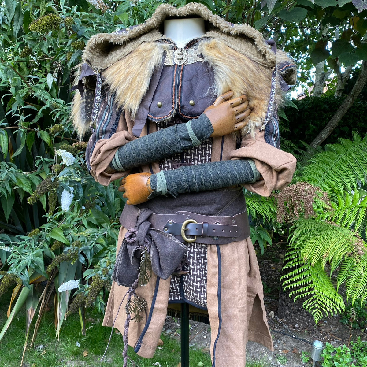 LARP costume detail with fur collar, green arm wraps, and belt.