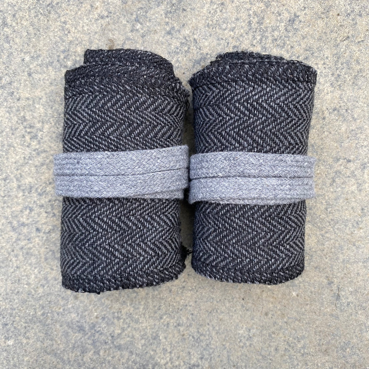 Grey and black herringbone wool leg and arm wraps for medieval LARP.