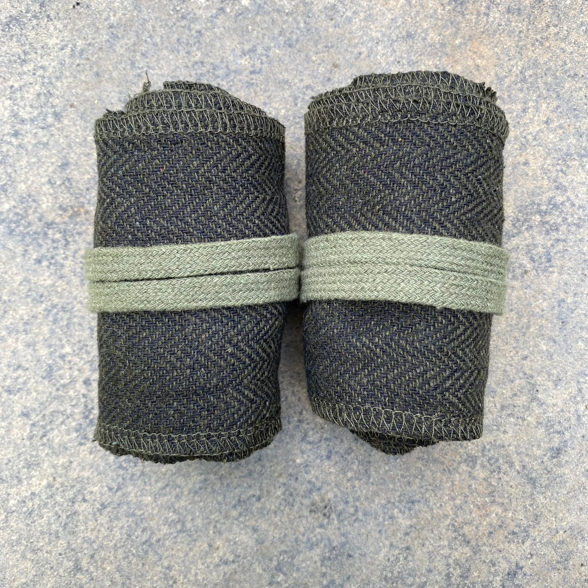 Green herringbone wool wraps for LARP, shown from above.