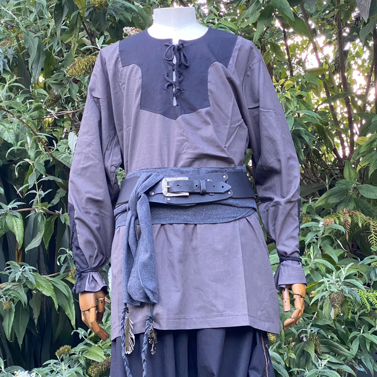 Grey medieval LARP outfit with waistcoat, shirt, belt, and scarf.