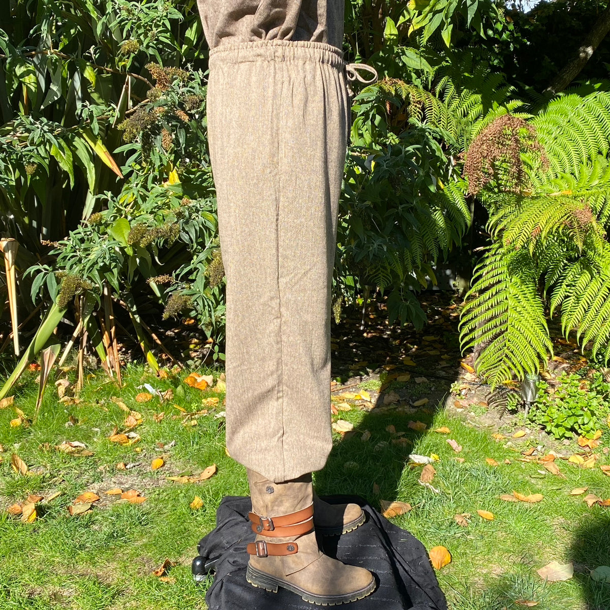 Side view of medieval LARP pants and boots.
