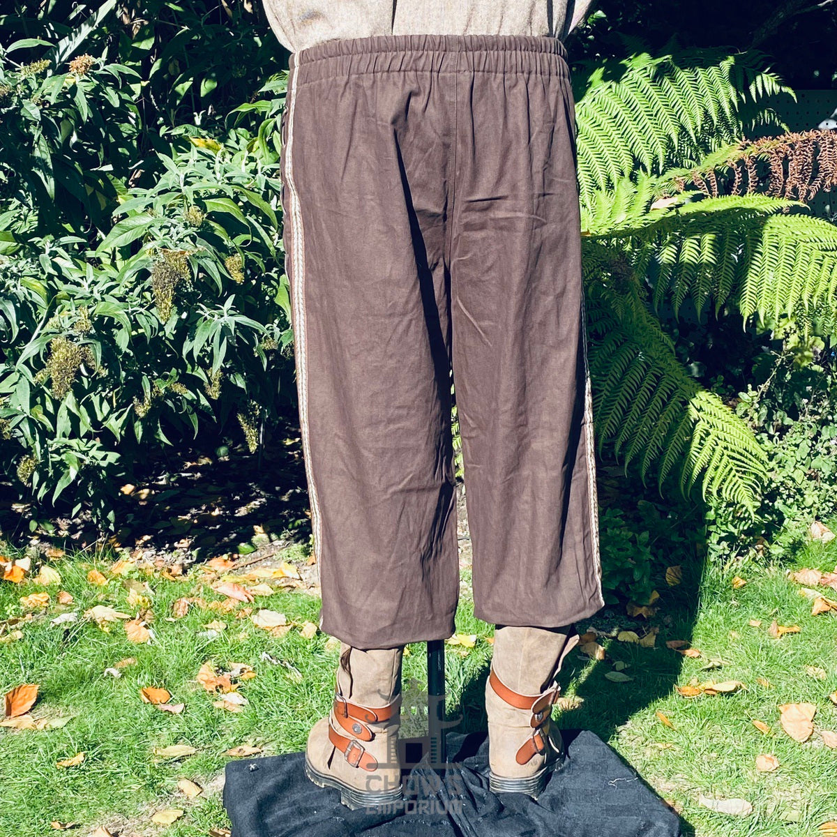 brown cotton medieval pants with side lacing and braiding back.