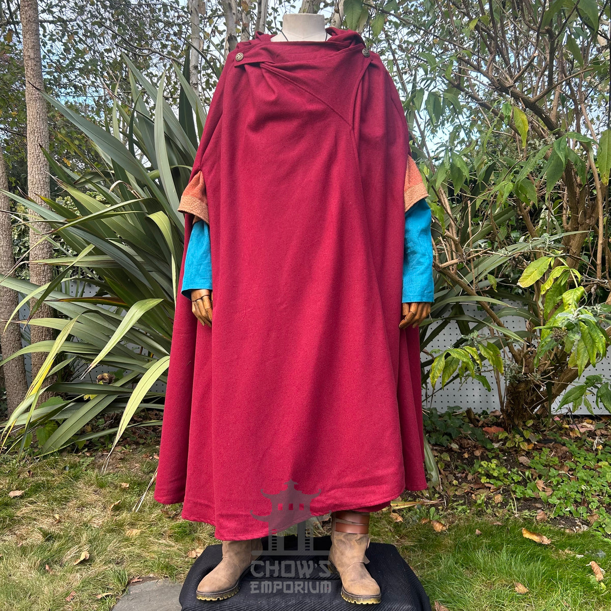 Full-length outdoor view of red medieval wool cloak, fantasy LARP cosplay costume for knights.