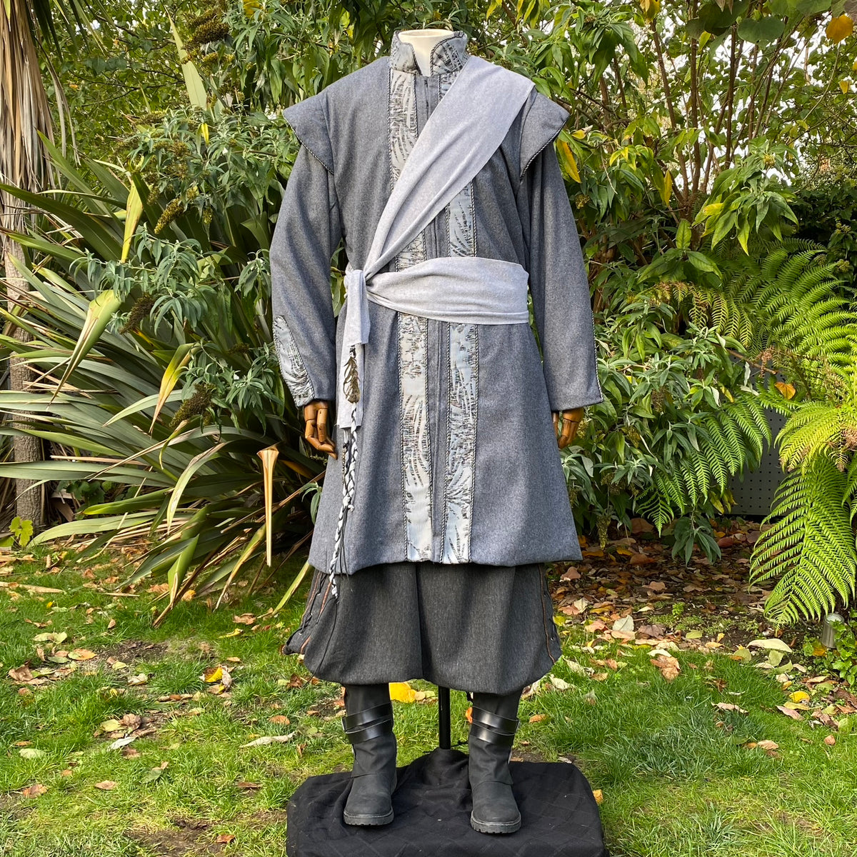 Medieval LARP outfit with detailed trim and sash.