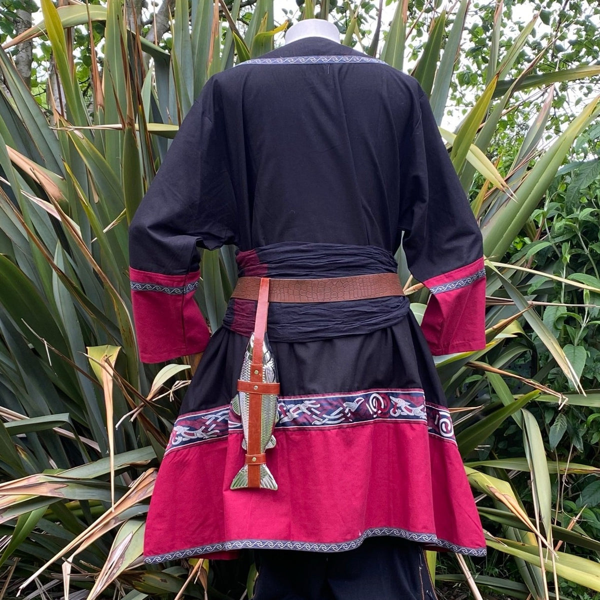 Back view of black-red medieval tunic with belt and knife for LARP events.