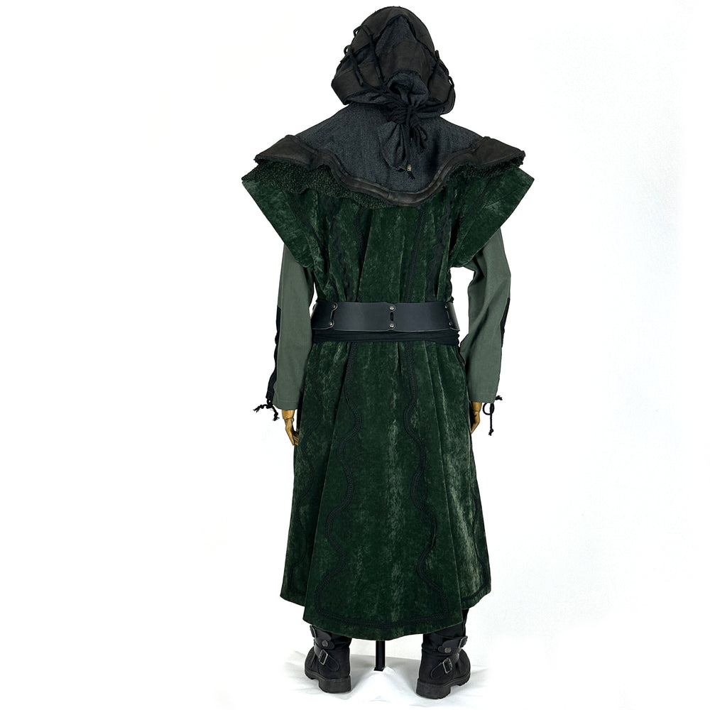 Back view of a medieval LARP costume, featuring a long green suede-effect waistcoat, leather and wool layered hood, shirt, pants, woolen sash and necklace. For Renaissance Faire and roleplay events.