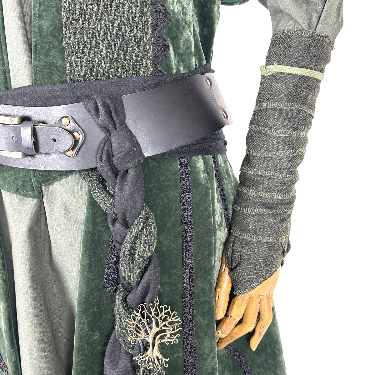 Green velvet LARP outfit with black belt, intricate arm wraps, and sash.