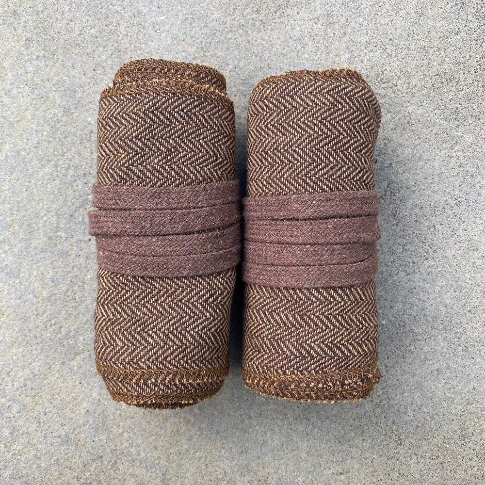 Set of Medieval LARPing Leg Wraps. They are Brown and made out of a Herringbone Wool mixture which are used to keep Trouser flares out of the way and legs warm. These Viking Wraps can wrap around your Legs to provide an extra flare to LARP kit.