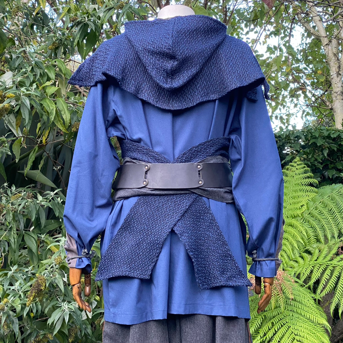 Rear view of blue medieval LARP hooded outfit with belt and mantle.