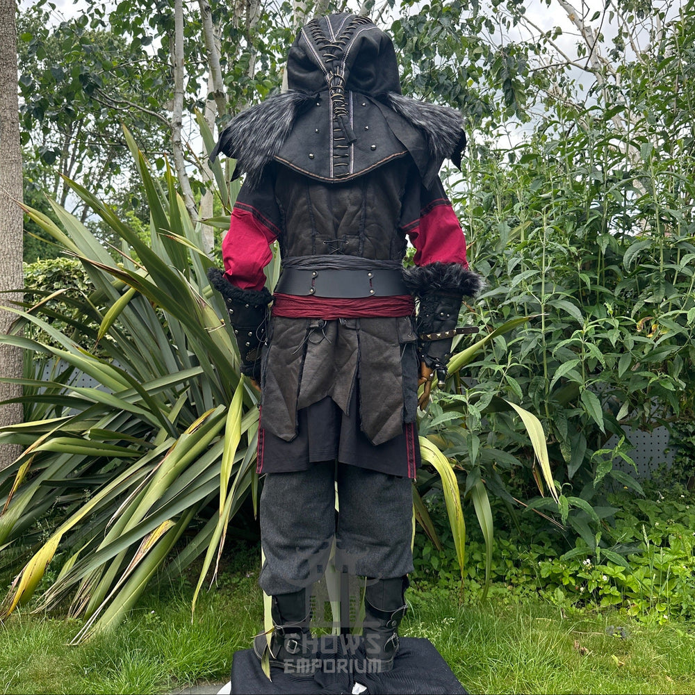 Medieval LARP outfit back view, featuring an ornate hood, waistcoat, tunic, trousers, vambraces, belt, and sash. For Renaissance Faire and historical roleplay events.