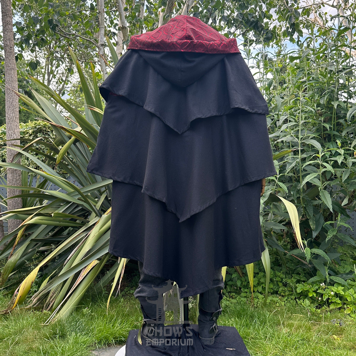 Hood down Back view of black three-layer medieval LARP cloak with red lining, fantasy cosplay.